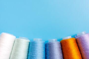 Skeins of wool yarn and knitting needles.