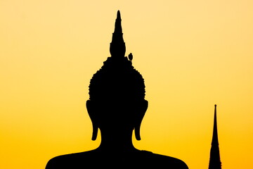 silhouette of buddha statue