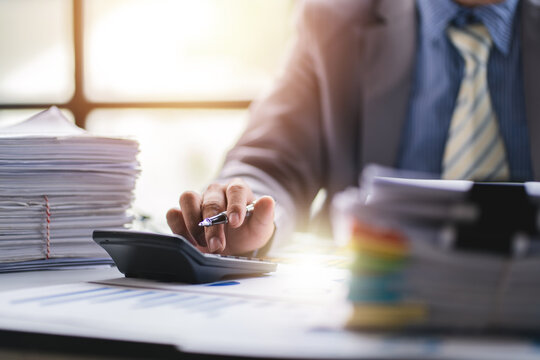 business documents businessman check legal document review Prepare documents or analysis reports, tax items, accounting documents, data contracts, office partner agreements.