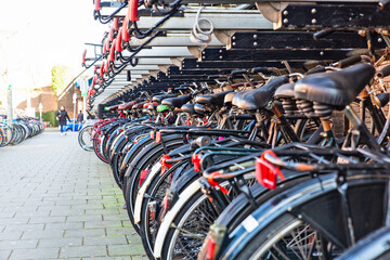 amsterdam and bicycles parked on the roadside
