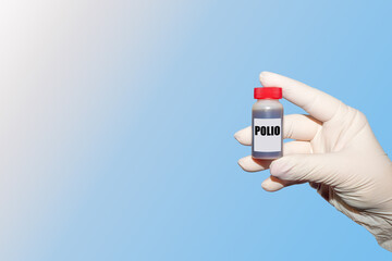 Polio virus. The doctor's hand holds a tissue sample of an infected polio. An outbreak of poliomyelitis.