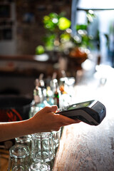 paying with smartphone at a bar