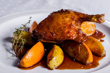 Grilled duck leg on the bone