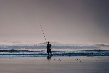 a man enjoying for fishing on the beach
