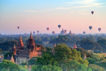 Hot air balloons over the old pagodas, Bagan, ancient city of the sea of ​​pagodas, Myanmar. © sippakorn