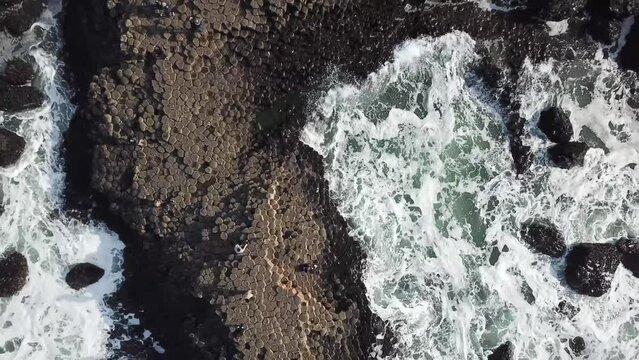 Giants Causeway (Birds eye ascent spiral Drone shot 4K)