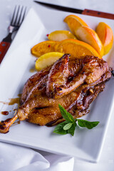 Grilled duck carcass in sauce