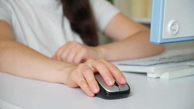 A woman has a sore wrist after working at the computer, tunnel syndrome