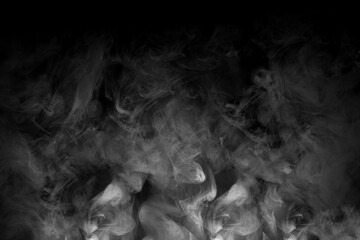 A white mist creeping over the night ground. Clouds of gray smoke rising from below on a black...