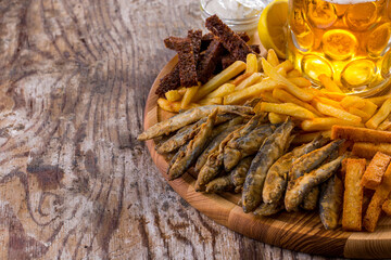 French fries, fish fried in batter, rye croutons, white bread croutons