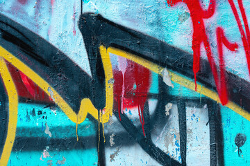 Closeup of colorful blue, teal and red urban wall texture. Modern pattern for wallpaper design. Creative modern urban city background for advertising mockups. Grunge messy street style background