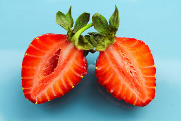 ripe delicious strawberries cut in half. fruit season