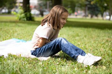 child sitting on the grass