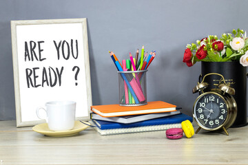 Back to school concept - pencil-box and books, notebook and are you ready in wooden ornate picture...