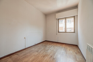 Fototapeta premium Living room with hardwood floors, aluminum radiator and bronze aluminum window