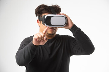 Young asian man using virtual reality headset. VR, future, gadgets, technology concept