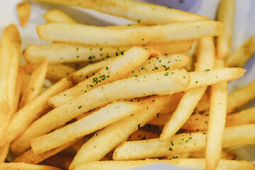 Close up of french fries on the plate. Western snacks.