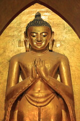 The smiling golden buddha statue in Myanmar.