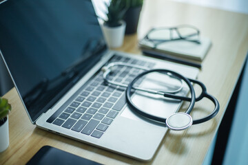 Obraz na płótnie Canvas Stethoscope on laptop keyboard, Healthcare and Medical concept.