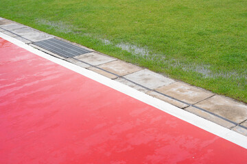 Concrete floor paint orange color for bicycle lane side green glass