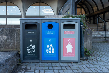 Garbage bin for plastic rain ponchos, garbage only, waste cans and bottles only. Trash container in...