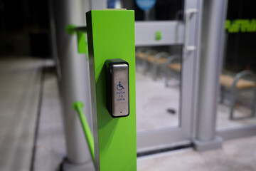 Push to open button for wheelchair users of the bus waiting pavilion.