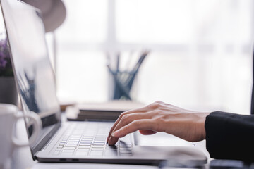 office girl's hands typing input data.