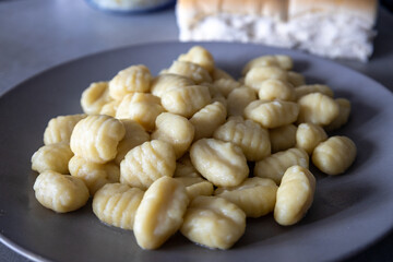 Gray plate containing a generous portion of freshly cooked food