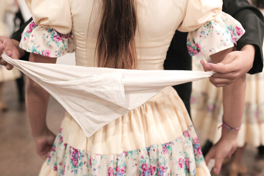detail shot of a couple of children dancing Argentine folklore