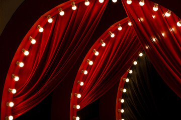 Red curtain background with bulbs