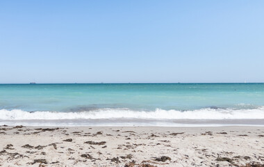 Bright beach background, view of sand waves and sky
