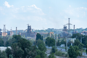View of industrial plant for the production of metal smelting. Metallurgical plant to the city. Steelmill. Blast furnaces on large integrated steelworks.The problem of ecology in a big city. Smoke.