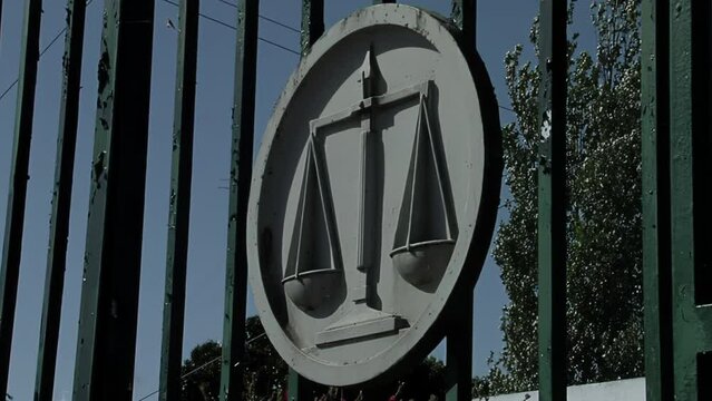 Scales of Justice Symbol On Fence  Outside a Prison in Buenos Aires Province, Argentina. Close Up.  