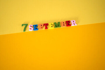 Calendar date of September 7 on a yellow background.