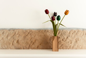 Wooden tulips on mantelpiece