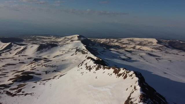 Above the snowy ridge