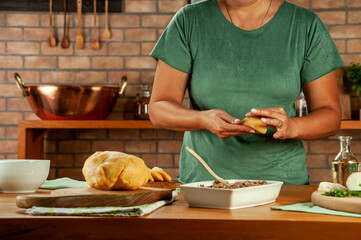 Woman preparing brazilian snacks beef stufing croquette (risolis de carne)