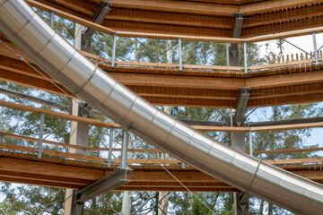 A Forest Walkway Surrounding a Giant Metal Slide