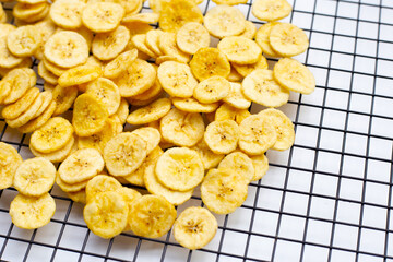 Banana slice chips on white background.