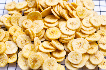Banana slice chips on white background.