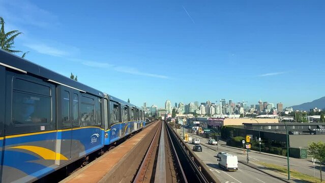 Train is traveling on the road towards another skytrain coming from the front window this is driverless subway train in Vancouver Canada is coming from Surrey Slow motion video is visible All around.