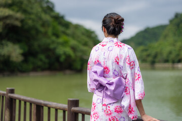 Japanese woman wear yukata at outdoor park