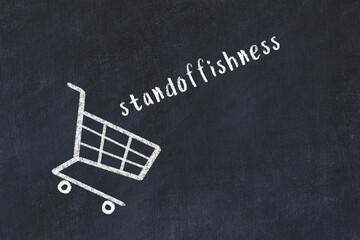 Chalk drawing of shopping cart and word standoffishness on black chalboard. Concept of globalization and mass consuming