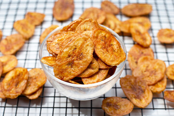 Banana chips on white background.