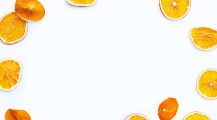 Frame made of dried orange slices on white background.