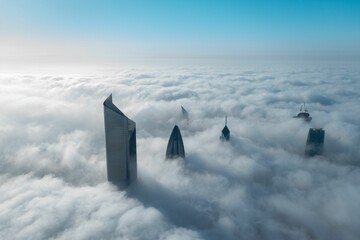 High tall building in Kuwait city covered with fog