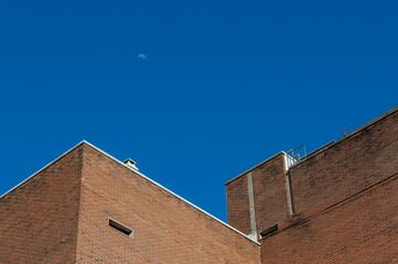 Low angle shot of a brick building under a blue sky in Buenos Aires, Argentina