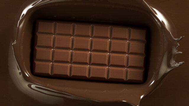 Chocolate bar with chocolate splashing around.