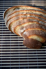 Sliced rye delicious bread on a mat. Lunch bread close-up.