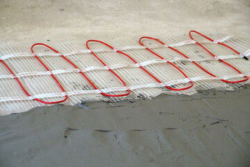 cable electric underfloor heating partially under cement screed